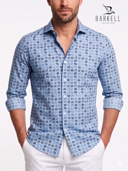 Cotton shirt with multicolored floral pattern. Light blue background. Small spread collar