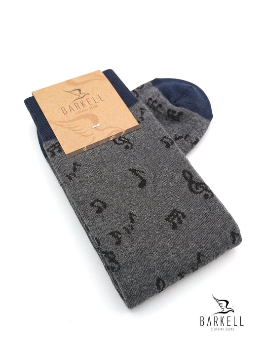 Chaussettes longues en coton chaud de haute qualité. Fond gris avec motif de notes de musique