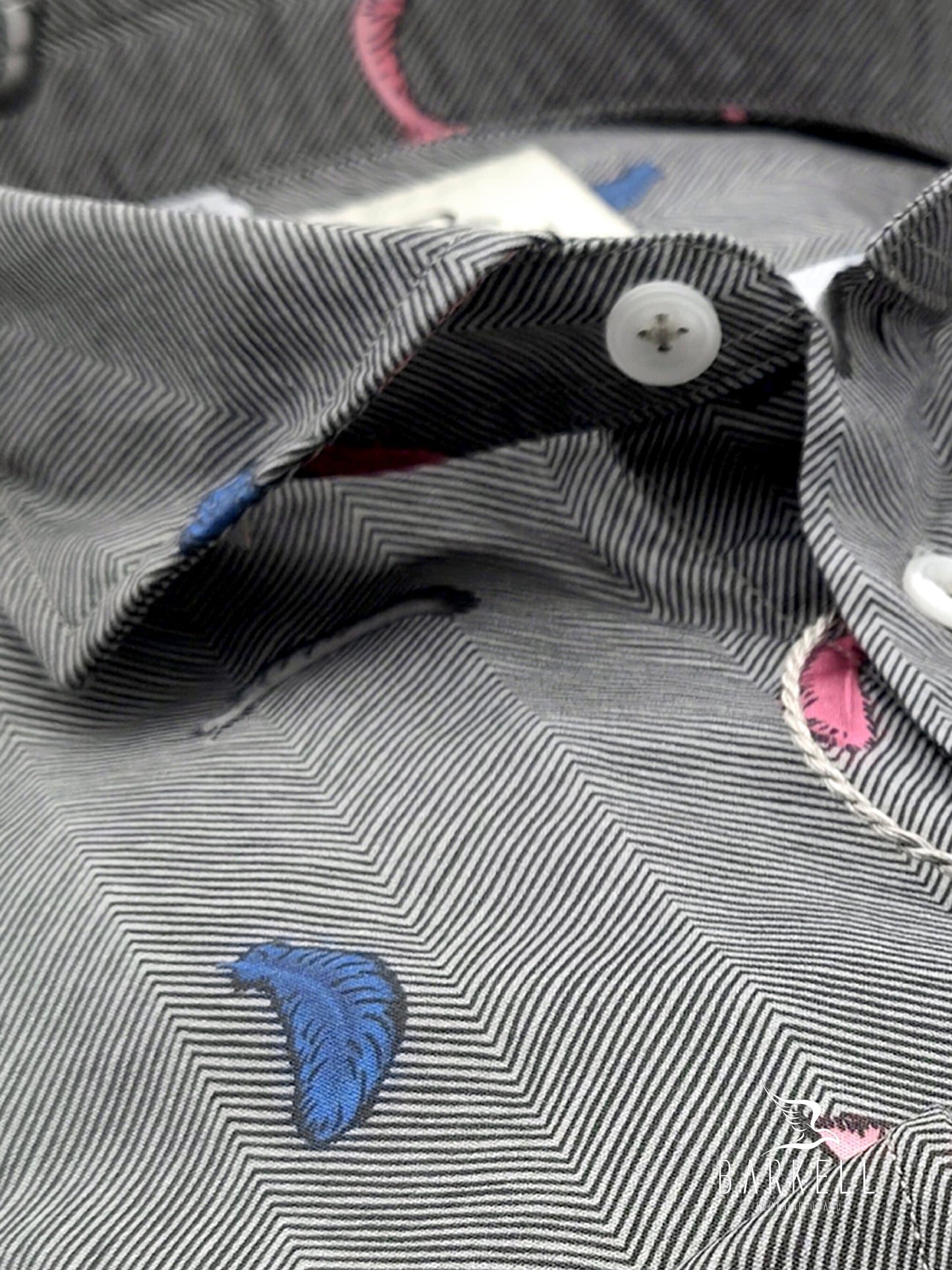 Fuchsia and light blue feather patterned cotton shirt with gray background. Small spread collar